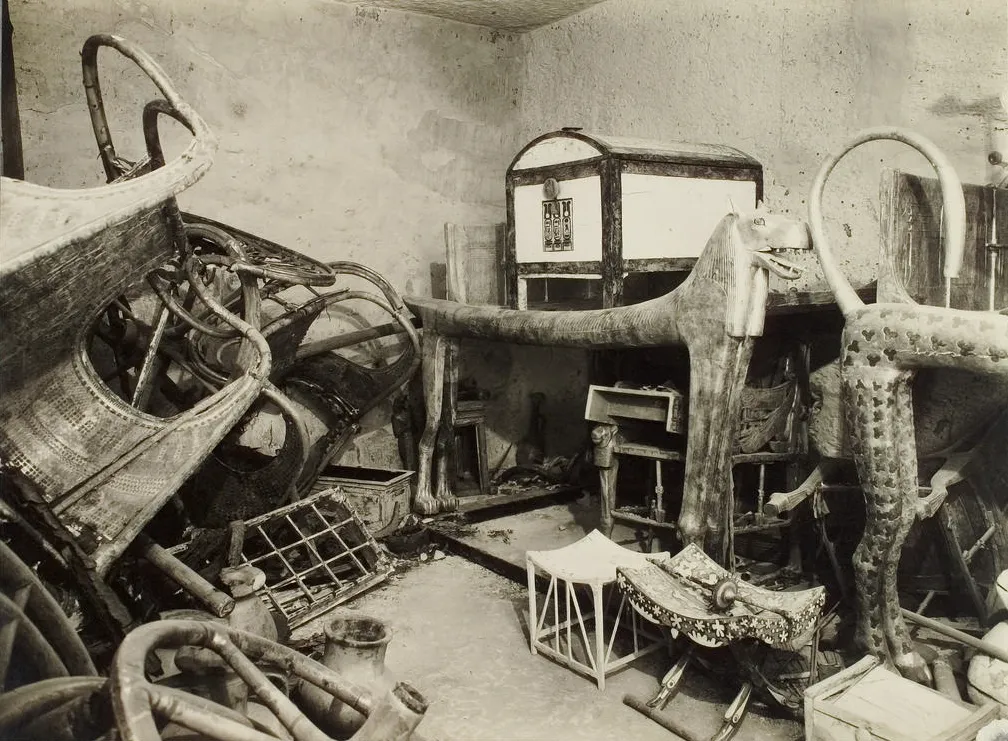 View of the southwest corner of the tomb's antechamber, with disassembled chariots on the left and furniture on the right