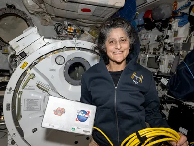 One of the images that triggered rumors about astronaut Suni Williams&#39; health. Here, she displays radiation measurement hardware.