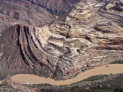 The Green River carves the landscape at Mitten Park fault, exposing rock layers formed more than a billion years ago – long before the dinosaurs.