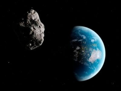 A stock illustration of an asteroid near Earth.&nbsp;Astronomers believe our &quot;mini-moon&quot; originated from the Arjuna asteroid belt.