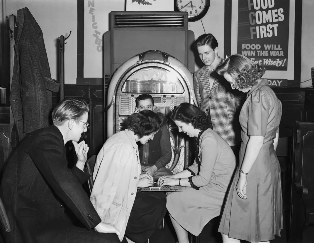 Two women use Ouija board circa 1940