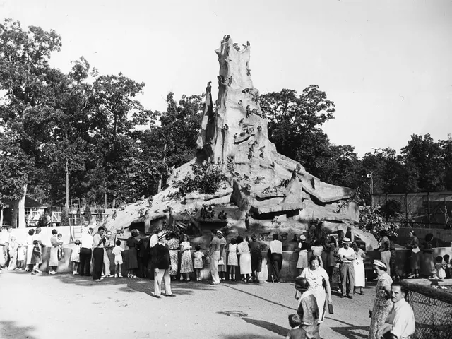 Visitors gather at the foot of Monkey Mountain, an attraction at Frank Buck&#39;s Jungle Camp in Massapequa, New York, around 1939.