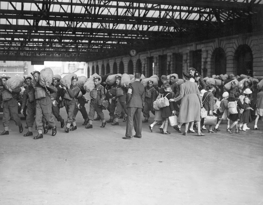 Soldiers arrive in London as children are evacuated from the wartorn city.