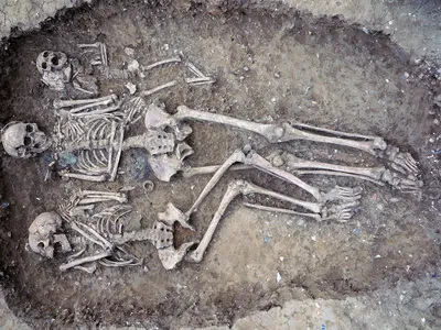 Grave 109 at Oakington is a rare triple burial, holding the remains of a female infant, a young woman (left) and an older woman (center).&nbsp;