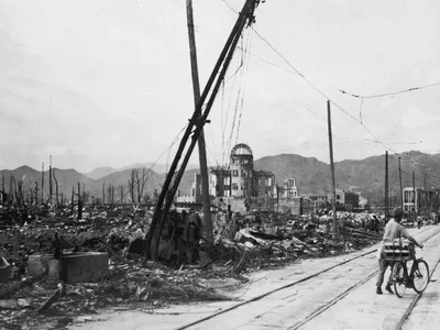 Man wheels bicycle through Hiroshima (social)